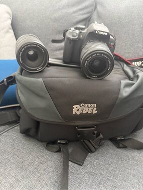 Canon Black DSLR with Two Interchangeable Lenses and Canon Rebel Bag